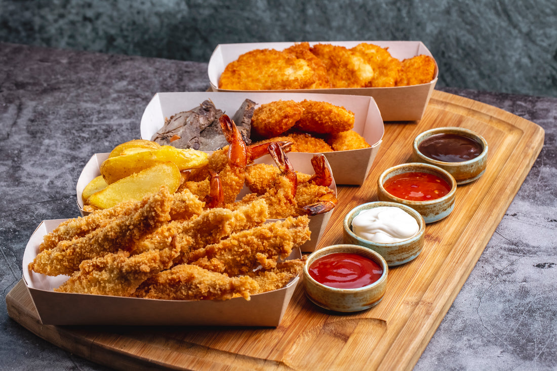 <a href="https://www.freepik.com/free-photo/four-boxes-nuggets-with-chicken-prawn-cheese-fish-with-four-sauce_7652136.htm#query=fried%20shrimp&position=9&from_view=search&track=sph">Image by stockking</a> on Freepik