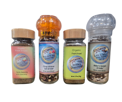 Four Southern Style & Spice seasoning containers on a white background